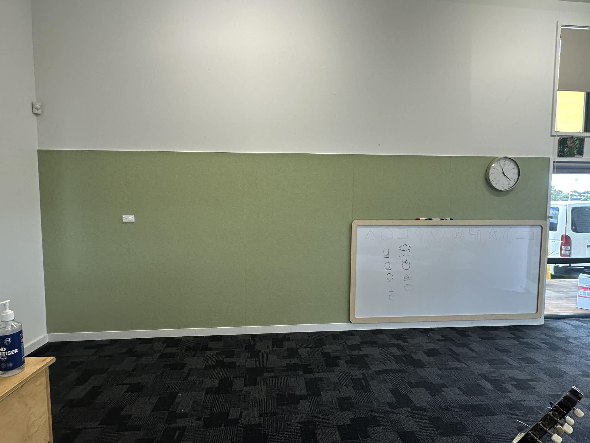 Colourful acoustic wall panel feature wall in an early learning room