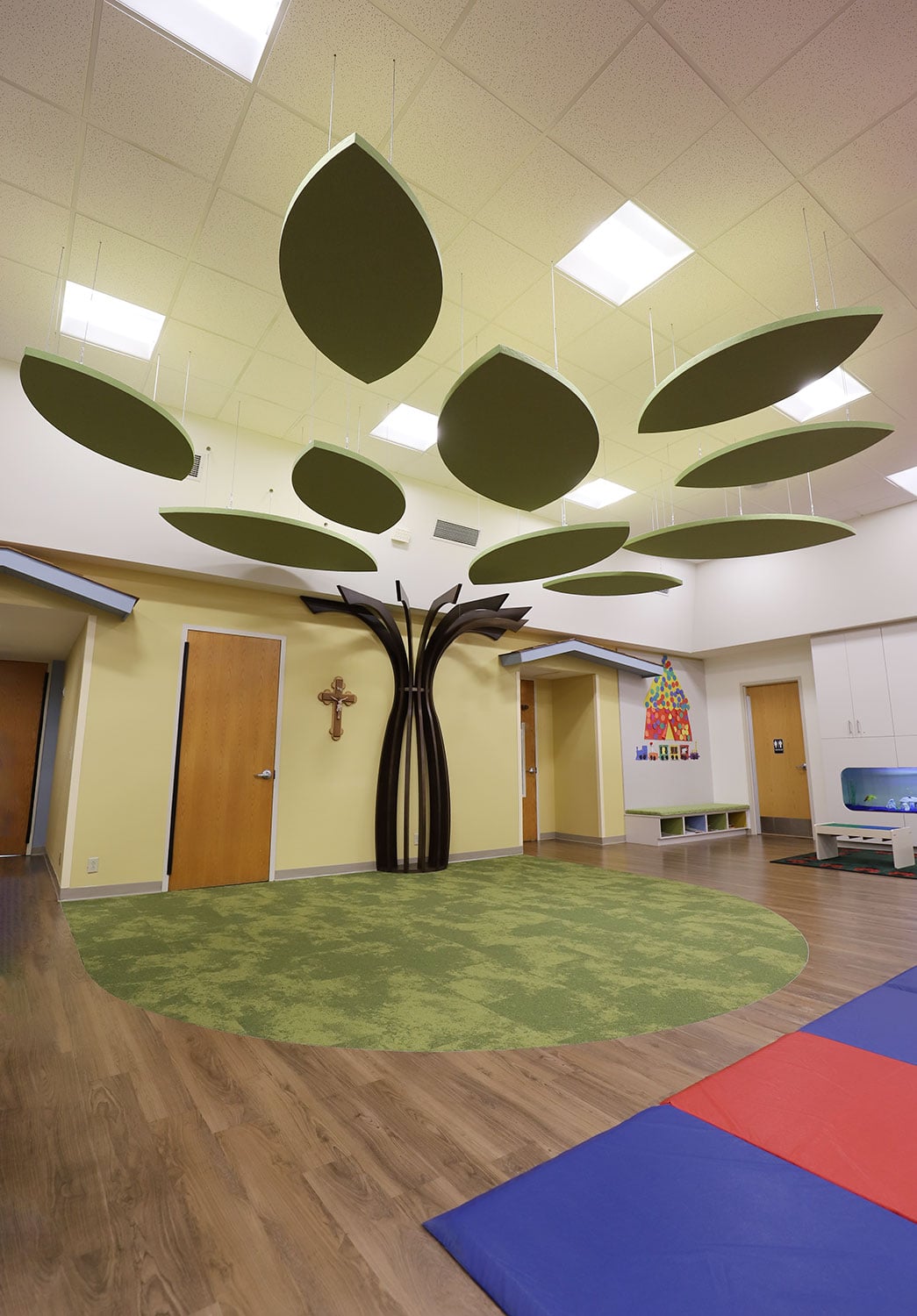Leaf-shaped acoustic wall panel feature wall in a New Zealand early learning centre